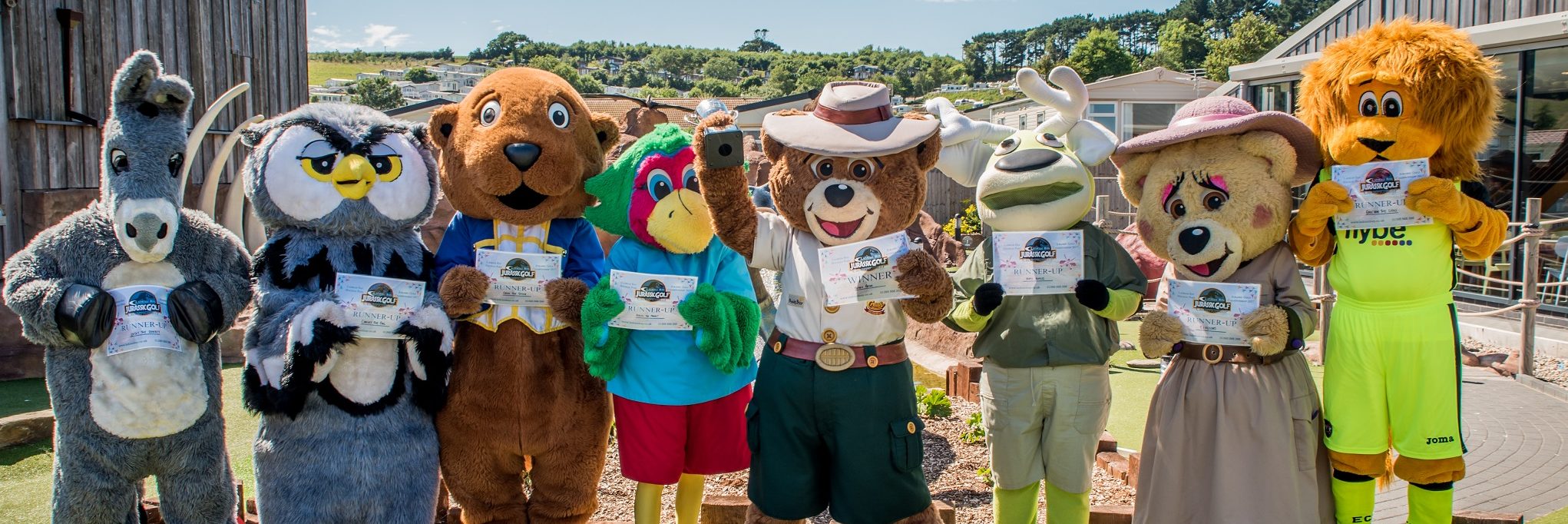 The whole in one: celebrity mascots proudly display their completion certificates at the end of the day's play
