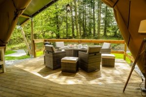 For al-fresco dining, the balcony overlooks the park's woodland
