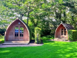 Guests' staying options include timber-built glamping pods